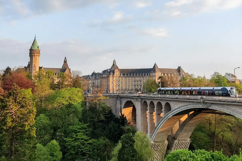 Tram on the Adolphe Bridge with the Spuerkeess headquarters behind