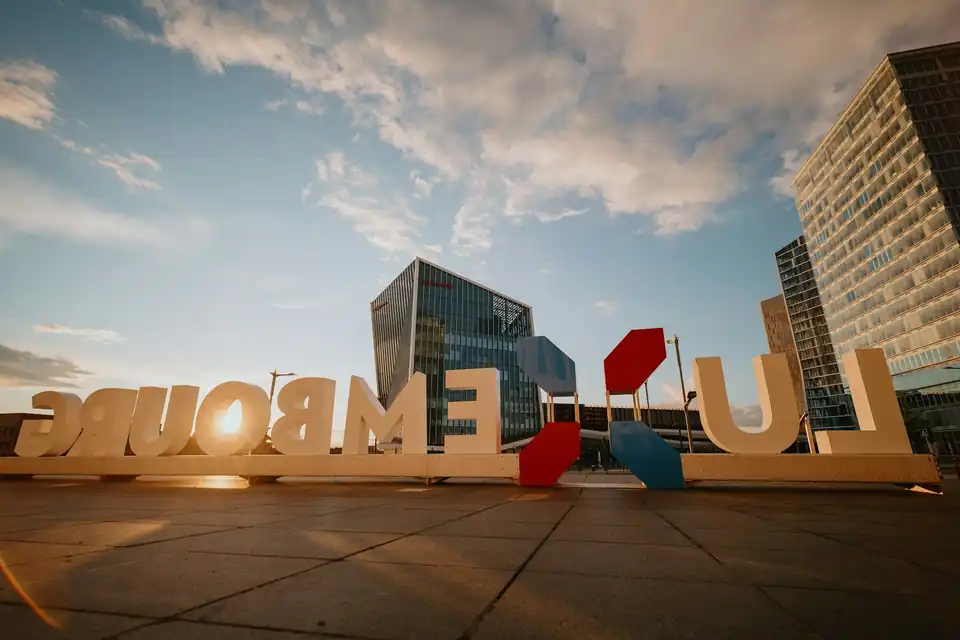 Large Luxembourg letters in front of office towers