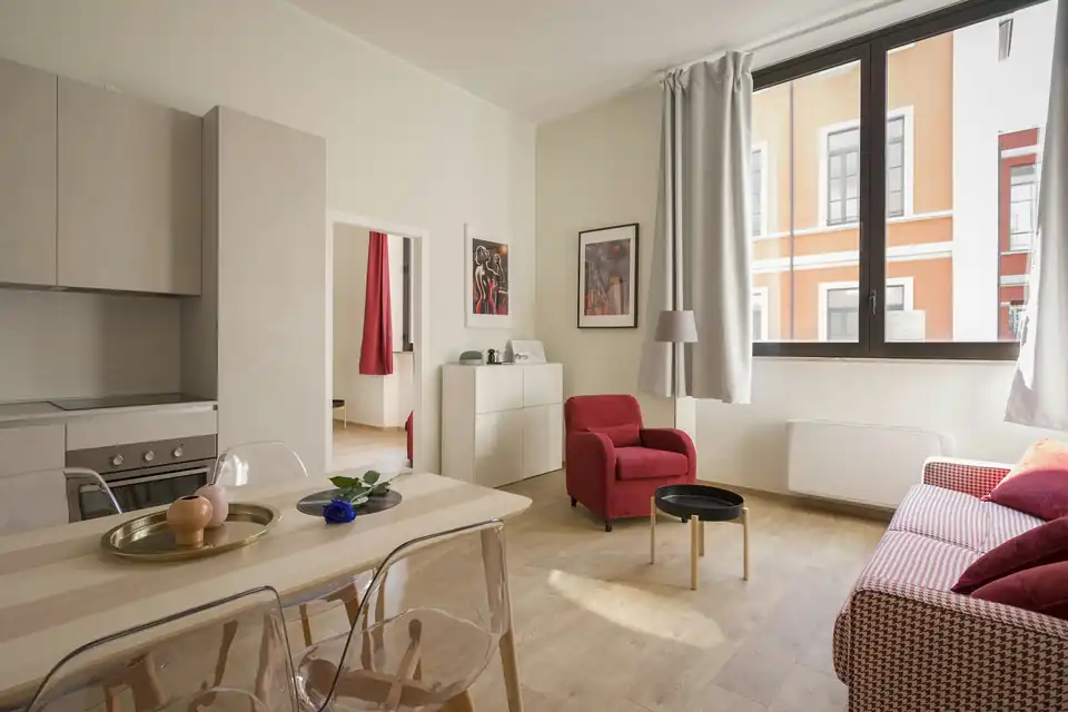 Furnished open-plan apartment with a dining table