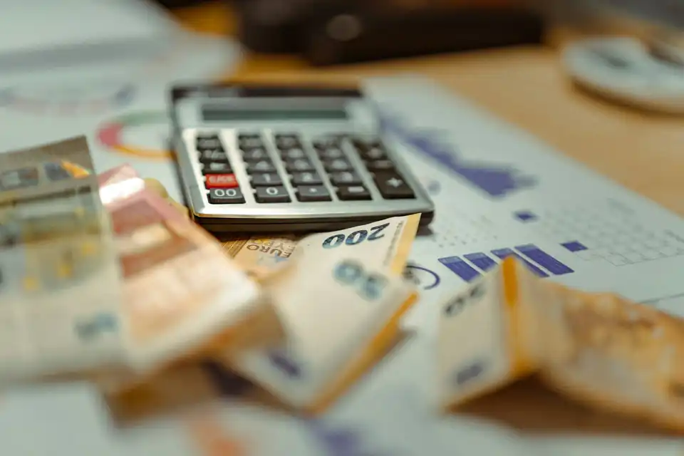Calculator on top of euro banknotes