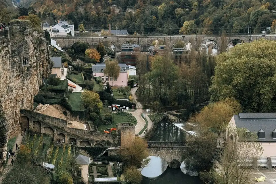 Gardens, footpaths and a river in the valley below the old town of Luxembourg City
