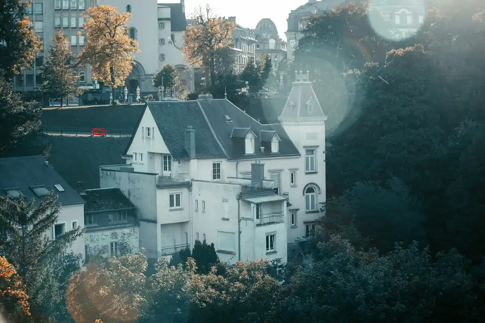 White houses among trees on a valley slope, Luxembourg City