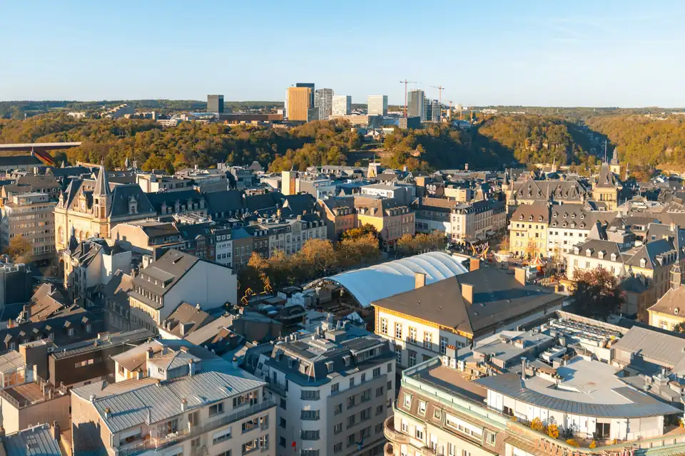 Old town roofs of Luxembourg City with Kirchberg office towers behind