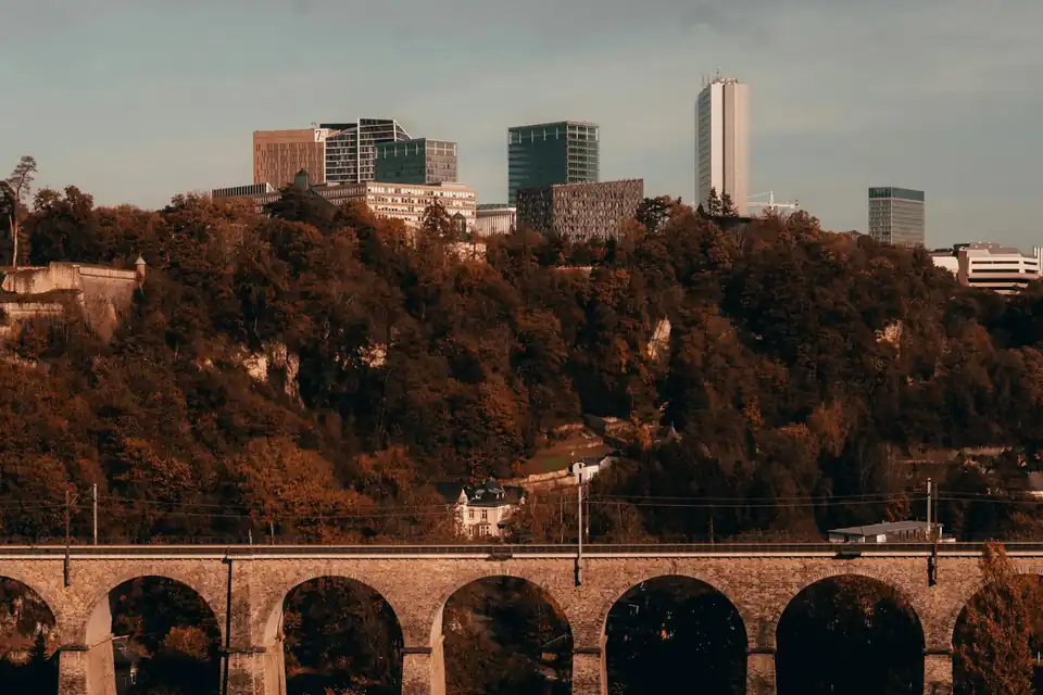 Stone viaduct with Kirchberg towers above the trees